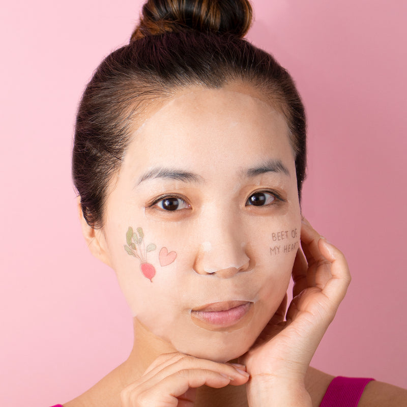 model wearing a sheet mask 